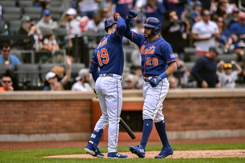 Jun 4, 2023; New York City, New York, USA; New York Mets left fielder Tommy Pham (28) is greeted by left fielder Mark Canha (19) after hitting a solo home run against the Toronto Blue Jays during the third inning at Citi Field. Mandatory Credit: John Jones-USA TODAY Sports