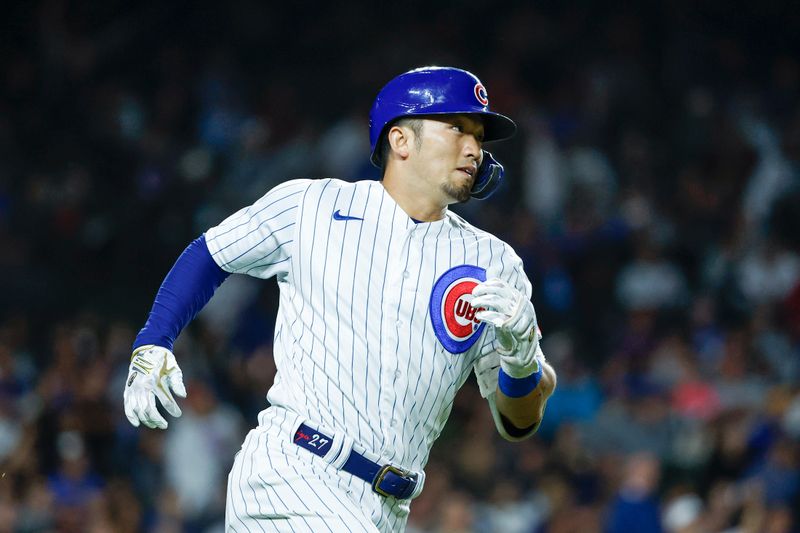 Sep 7, 2023; Chicago, Illinois, USA; Chicago Cubs right fielder Seiya Suzuki (27) runs after hitting a triple against the Arizona Diamondbacks during the fifth inning at Wrigley Field. Mandatory Credit: Kamil Krzaczynski-USA TODAY Sports