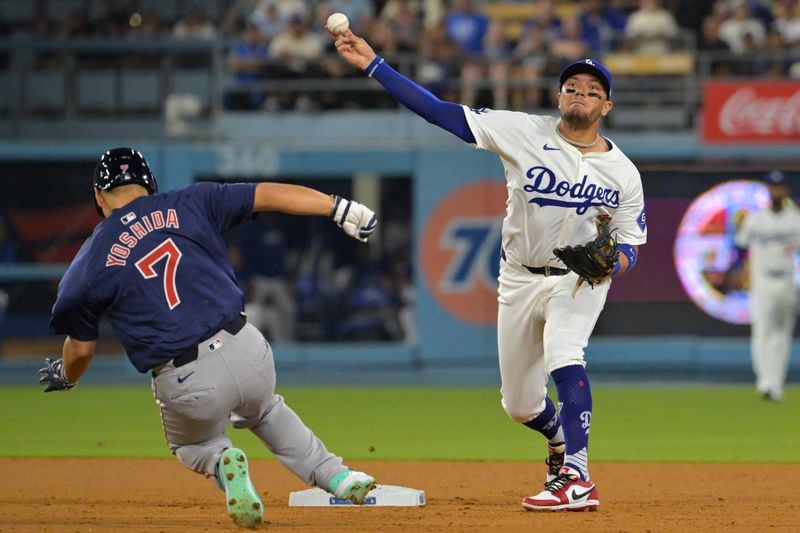 Jul 19, 2024; Los Angeles, California, USA; Boston Red Sox left fielder Tyler O'Neill (17) is out at second as Los Angeles Dodgers shortstop Miguel Rojas (11) throws to first for a double play to end the game in the ninth inning against the Boston Red Sox at Dodger Stadium. Mandatory Credit: Jayne Kamin-Oncea-USA TODAY Sports