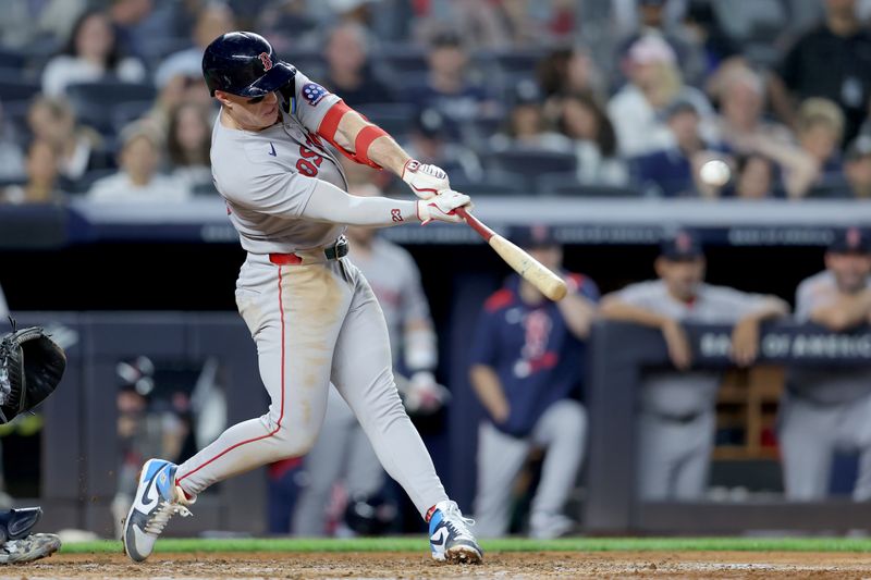 Jun 7, 2025; Bronx, New York, USA; Boston Red Sox first baseman Romy Gonzalez (23) hits a two run home run against the New York Yankees during the fourth inning at Yankee Stadium. Mandatory Credit: Brad Penner-Imagn Images