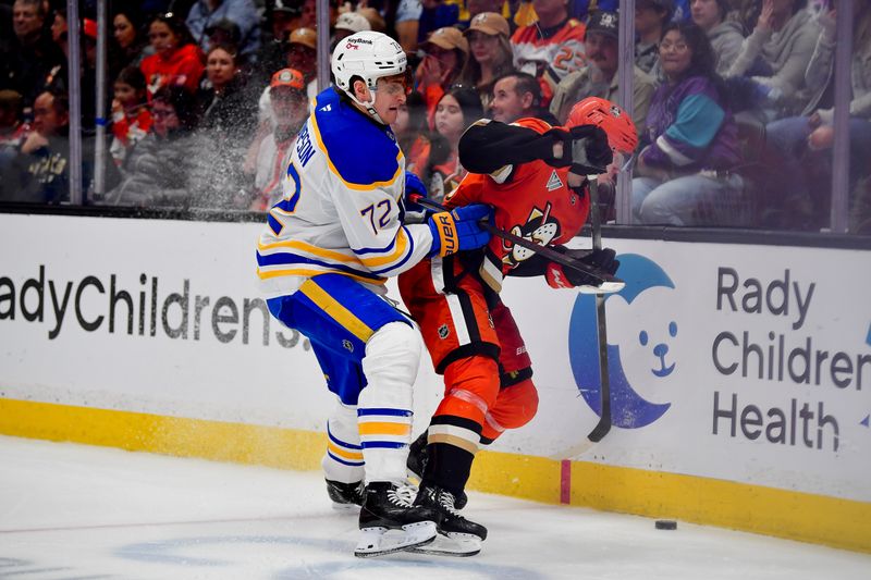 Mar 22, 2026; Anaheim, California, USA; Buffalo Sabres center Tage Thompson (72) plays for the puck against Anaheim Ducks defenseman Pavel Mintyukov (98) during the third period at Honda Center. Mandatory Credit: Gary A. Vasquez-Imagn Images