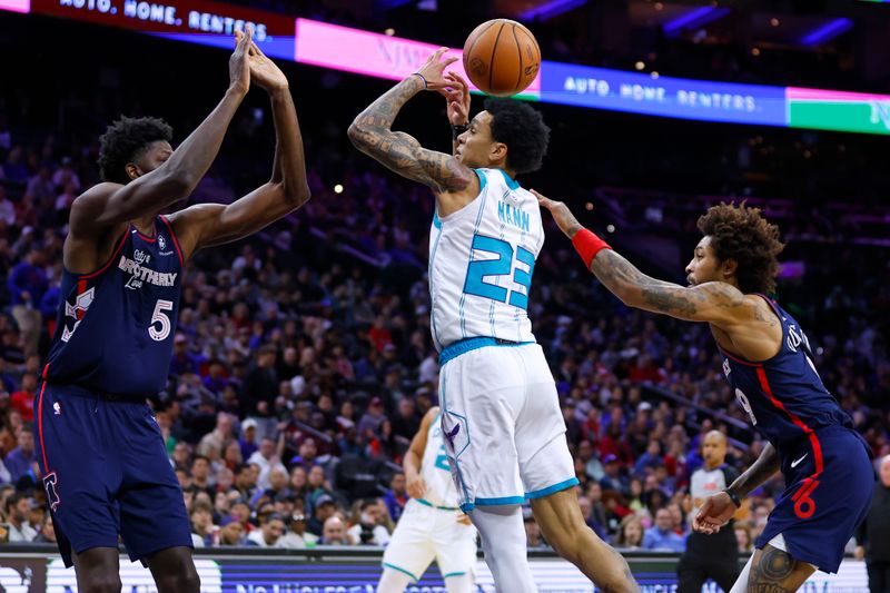 PHILADELPHIA, PENNSYLVANIA - MARCH 16: Tre Mann #23 of the Charlotte Hornets loses control of the ball after being fouled by Kelly Oubre Jr. #9 of the Philadelphia 76ers as Mo Bamba #5 defends during the first half of a game at the Wells Fargo Center on March 16, 2024 in Philadelphia, Pennsylvania. NOTE TO USER: User expressly acknowledges and agrees that, by downloading and or using this photograph, User is consenting to the terms and conditions of the Getty Images License Agreement. (Photo by Rich Schultz/Getty Images)