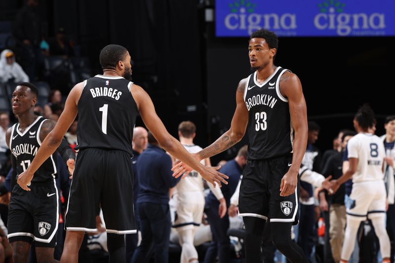 MEMPHIS, TN - February 26:  Mikal Bridges #1 and Nicolas Claxton #33 of the Brooklyn Nets celebrate during the game against the Memphis Grizzlies on February 26, 2024 at FedExForum in Memphis, Tennessee. NOTE TO USER: User expressly acknowledges and agrees that, by downloading and or using this photograph, User is consenting to the terms and conditions of the Getty Images License Agreement. Mandatory Copyright Notice: Copyright 2024 NBAE (Photo by Joe Murphy/NBAE via Getty Images)