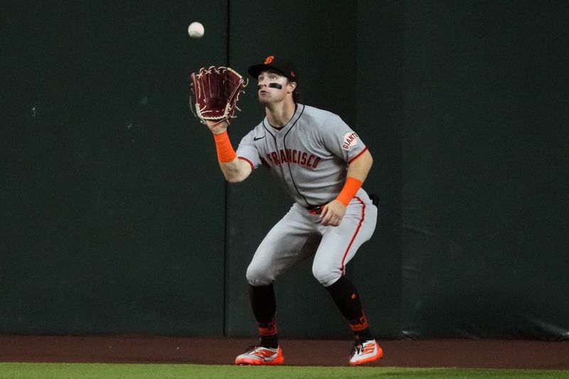 Sep 17, 2025; Phoenix, Arizona, USA; San Francisco Giants outfielder Drew Gilbert (61) makes the catch for an out against the Arizona Diamondbacks in the seventh inning at Chase Field. Mandatory Credit: Rick Scuteri-Imagn Images