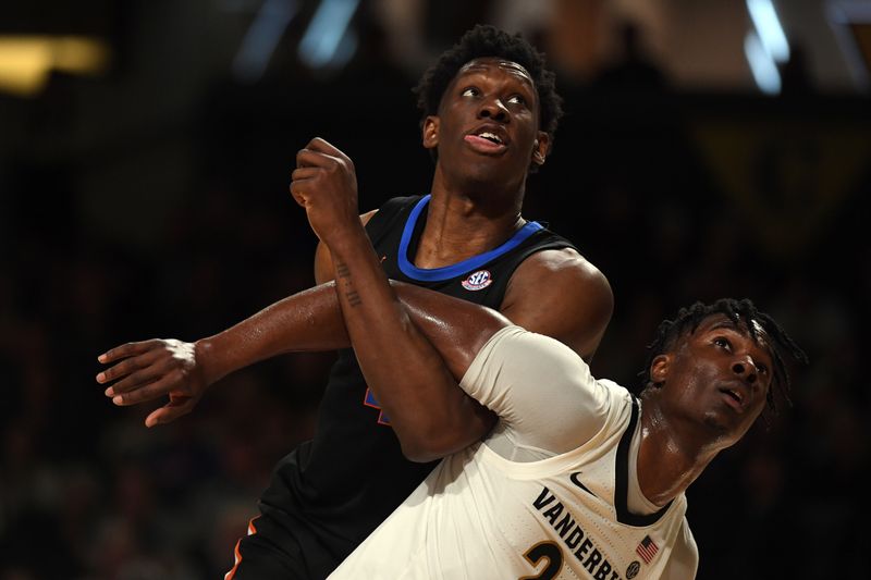 Mar 9, 2024; Nashville, Tennessee, USA; Florida Gators forward Tyrese Samuel (4) and Vanderbilt Commodores forward JaQualon Roberts (24) work for position on a rebound during the second half at Memorial Gymnasium. Mandatory Credit: Christopher Hanewinckel-USA TODAY Sports