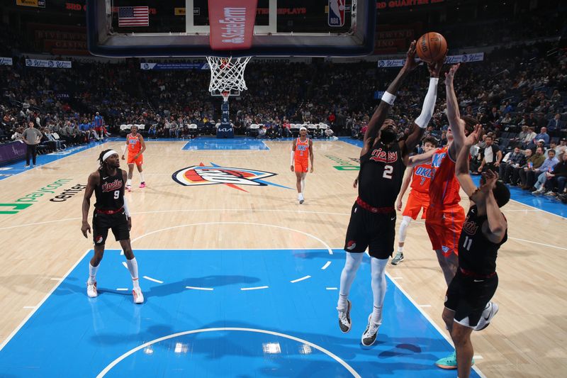 OKLAHOMA CITY, OK - JANUARY 23: Deandre Ayton #2 of the Portland Trail Blazers grabs the rebound during the game against the Oklahoma City Thunder on January 23, 2024 at Paycom Arena in Oklahoma City, Oklahoma. NOTE TO USER: User expressly acknowledges and agrees that, by downloading and or using this photograph, User is consenting to the terms and conditions of the Getty Images License Agreement. Mandatory Copyright Notice: Copyright 2024 NBAE (Photo by Zach Beeker/NBAE via Getty Images)