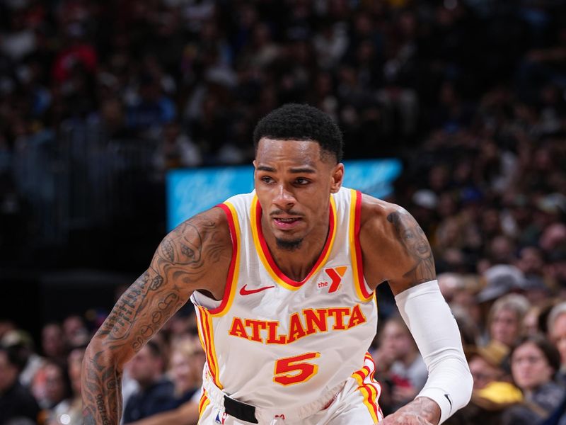 DENVER, CO - APRIL 6: Dejounte Murray #5 of the Atlanta Hawks dribbles the ball during the game against the Denver Nuggets on April 6, 2024 at the Ball Arena in Denver, Colorado. NOTE TO USER: User expressly acknowledges and agrees that, by downloading and/or using this Photograph, user is consenting to the terms and conditions of the Getty Images License Agreement. Mandatory Copyright Notice: Copyright 2024 NBAE (Photo by Garrett Ellwood/NBAE via Getty Images)