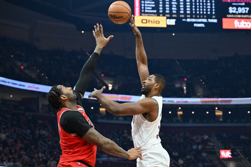 CLEVELAND, OHIO - JANUARY 15: Tristan Thompson #13 of the Cleveland Cavaliers shoots against Andre Drummond #3 of the Chicago Bulls during the first half at Rocket Mortgage Fieldhouse on January 15, 2024 in Cleveland, Ohio. NOTE TO USER: User expressly acknowledges and agrees that, by downloading and or using this photograph, User is consenting to the terms and conditions of the Getty Images License Agreement. (Photo by Nick Cammett/Getty Images)