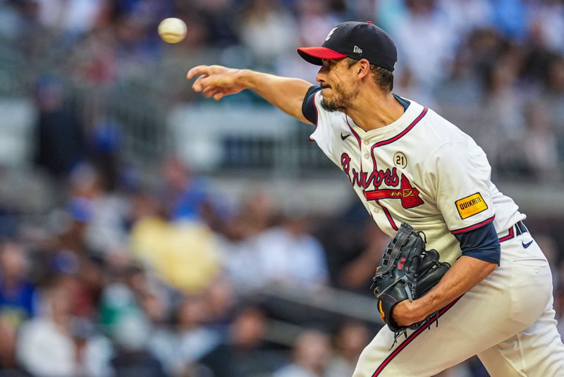 Sep 15, 2024; Cumberland, Georgia, USA; Atlanta Braves starting pitcher Charlie Morton (50) pitches against the Los Angeles Dodgers during the first inning at Truist Park. Mandatory Credit: Dale Zanine-Imagn Images