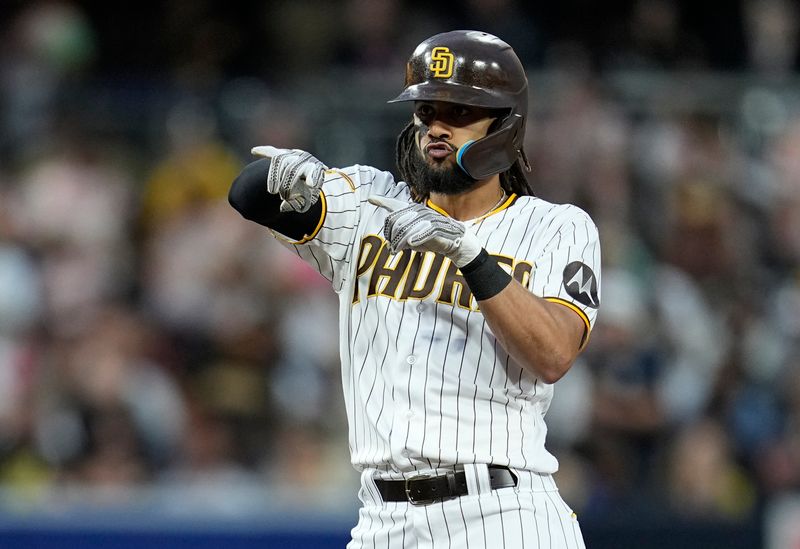 Jun 14, 2023; San Diego, California, USA;  San Diego Padres right fielder Fernando Tatis Jr. (23) reacts to his double against the Cleveland Guardians during the fourth inning at Petco Park. Mandatory Credit: Ray Acevedo-USA TODAY Sports