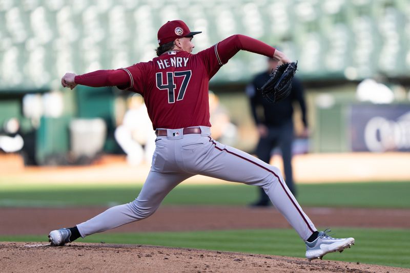 May 16, 2023; Oakland, California, USA; Arizona Diamondbacks starting pitcher Tommy Henry (47) pitches during the first inning against the Oakland Athletics at Oakland-Alameda County Coliseum. Mandatory Credit: Stan Szeto-USA TODAY Sports