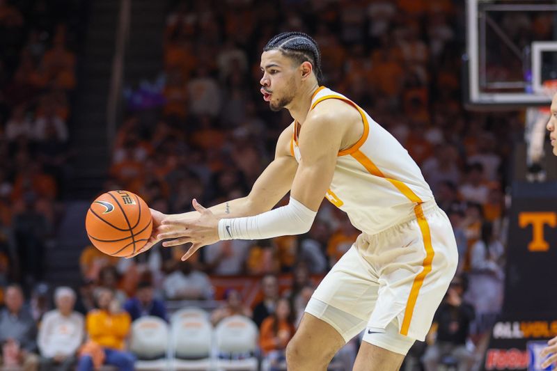 Feb 28, 2023; Knoxville, Tennessee, USA; Tennessee Volunteers forward Olivier Nkamhoua (13) passes the ball against the Arkansas Razorbacks during the second half at Thompson-Boling Arena. Mandatory Credit: Randy Sartin-USA TODAY Sports