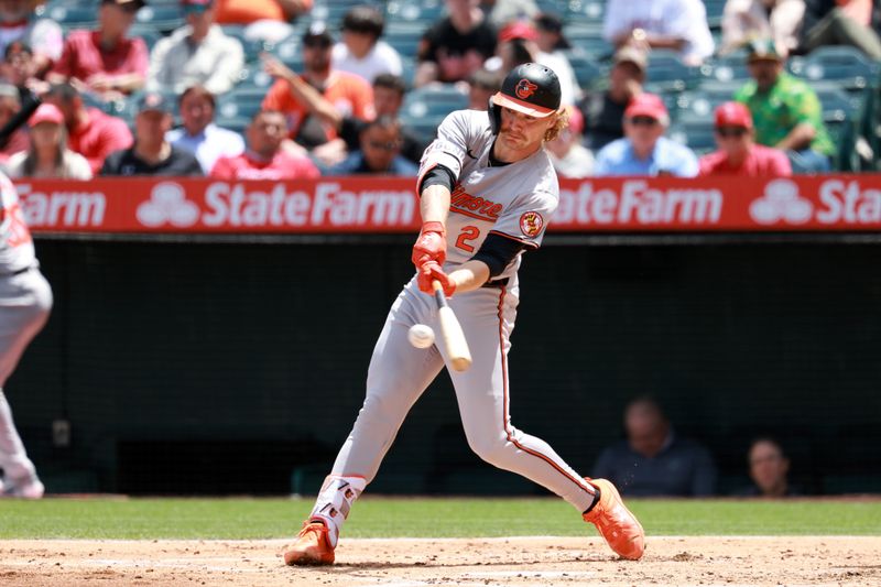 Apr 24, 2024; Anaheim, California, USA;  Baltimore Orioles shortstop Gunnar Henderson (2) hits a home run during the third inning against the Los Angeles Angels at Angel Stadium. Mandatory Credit: Kiyoshi Mio-USA TODAY Sports