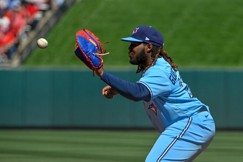 Apr 2, 2023; St. Louis, Missouri, USA;  Toronto Blue Jays first baseman Vladimir Guerrero Jr. (27) catches a throw against the the St. Louis Cardinals during the third inning at Busch Stadium. Mandatory Credit: Jeff Curry-USA TODAY Sports