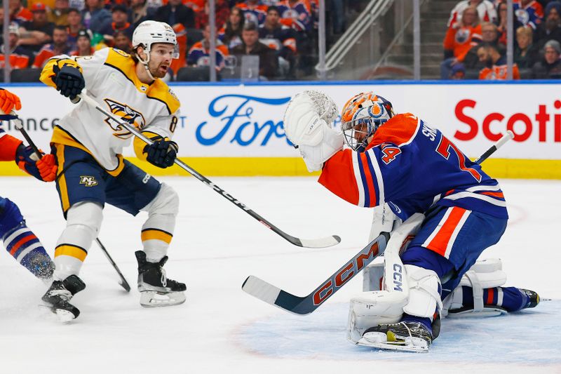 Jan 27, 2024; Edmonton, Alberta, CAN; Edmonton Oilers goaltender Stuart Skinner (74) makes a save on Nashville Predators forward Tommy Novak (82) during the second period at Rogers Place. Mandatory Credit: Perry Nelson-USA TODAY Sports