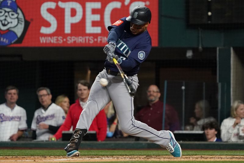 May 3, 2025; Arlington, Texas, USA; Seattle Mariners third baseman Jorge Polanco (7) hits a double during the ninth inning against the Texas Rangers at Globe Life Field. Mandatory Credit: Raymond Carlin III-Imagn Images
