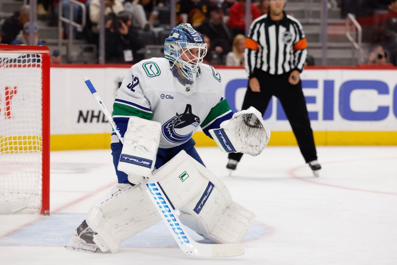 Jan 8, 2026; Detroit, Michigan, USA;  Vancouver Canucks goaltender Kevin Lankinen (32) tends goal in the second period against the Detroit Red Wings at Little Caesars Arena. Mandatory Credit: Rick Osentoski-Imagn Images