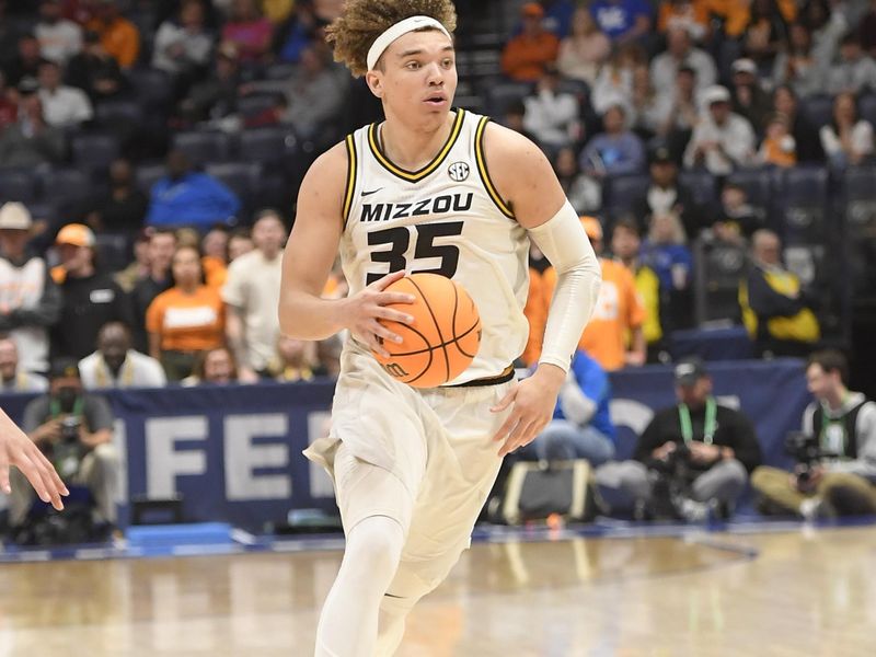 Mar 10, 2023; Nashville, TN, USA;  Missouri Tigers forward Noah Carter (35) dribbles the ball during the second half at Bridgestone Arena. Mandatory Credit: Steve Roberts-USA TODAY Sports