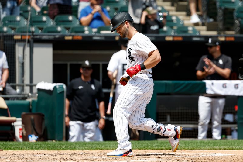 Jul 14, 2024; Chicago, Illinois, USA; Chicago White Sox outfielder Andrew Benintendi (23) crosses home plate after hitting a solo home run against the Pittsburgh Pirates during the third inning at Guaranteed Rate Field. Mandatory Credit: Kamil Krzaczynski-USA TODAY Sports