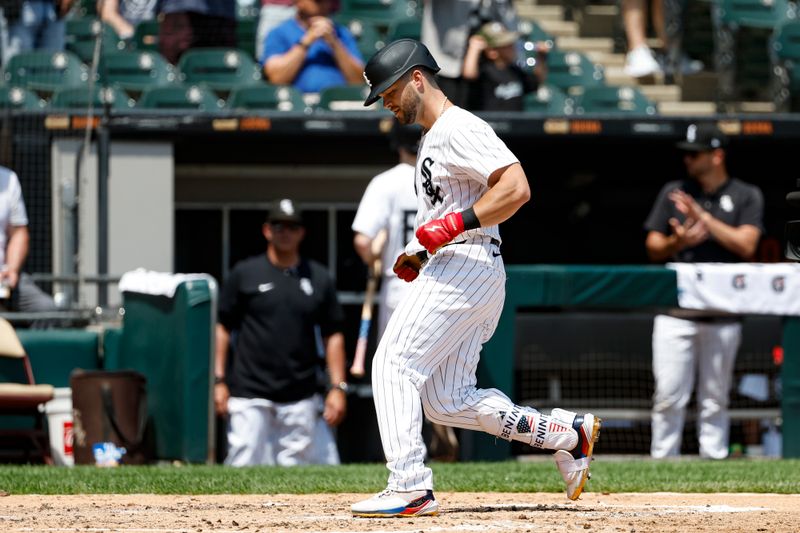 Jul 14, 2024; Chicago, Illinois, USA; Chicago White Sox outfielder Andrew Benintendi (23) crosses home plate after hitting a solo home run against the Pittsburgh Pirates during the third inning at Guaranteed Rate Field. Mandatory Credit: Kamil Krzaczynski-USA TODAY Sports