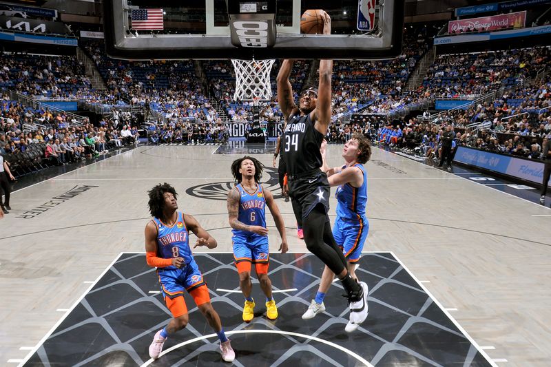 ORLANDO, FL - JANUARY 4: Wendell Carter Jr. #34 of the Orlando Magic dunks the ball against the Oklahoma City Thunder January 4, 2023 at Amway Center in Orlando, Florida. NOTE TO USER: User expressly acknowledges and agrees that, by downloading and or using this photograph, User is consenting to the terms and conditions of the Getty Images License Agreement. Mandatory Copyright Notice: Copyright 2023 NBAE (Photo by Fernando Medina/NBAE via Getty Images)