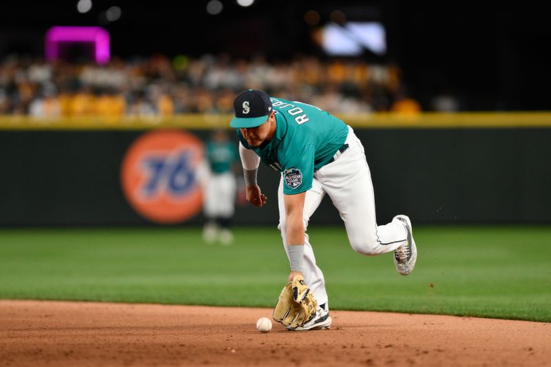 Aug 12, 2023; Seattle, Washington, USA; Seattle Mariners second baseman Josh Rojas (4) fields a ground ball against the Baltimore Orioles during the eighth inning at T-Mobile Park. Mandatory Credit: Steven Bisig-USA TODAY Sports