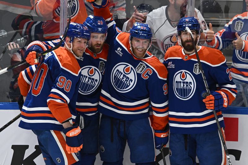 Jun 6, 2025; Edmonton, Alberta, CAN; Edmonton Oilers center Leon Draisaitl (29) reacts with center Connor McDavid (97) and defenseman Evan Bouchard (2) after scoring a goal against the Florida Panthers during the first period in game two of the 2025 Stanley Cup Final at Rogers Place. Mandatory Credit: Walter Tychnowicz-Imagn Images