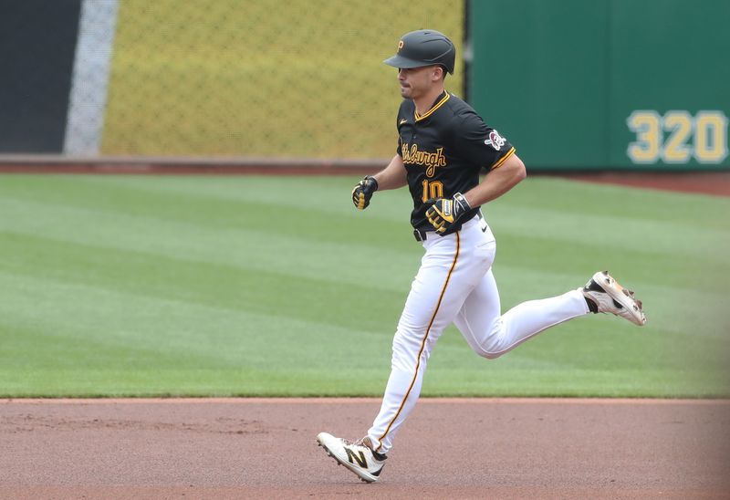 May 1, 2025; Pittsburgh, Pennsylvania, USA;  Pittsburgh Pirates right fielder Bryan Reynolds (10) circles the bases on a solo home run against the Chicago Cubs during the first inning at PNC Park. Mandatory Credit: Charles LeClaire-Imagn Images