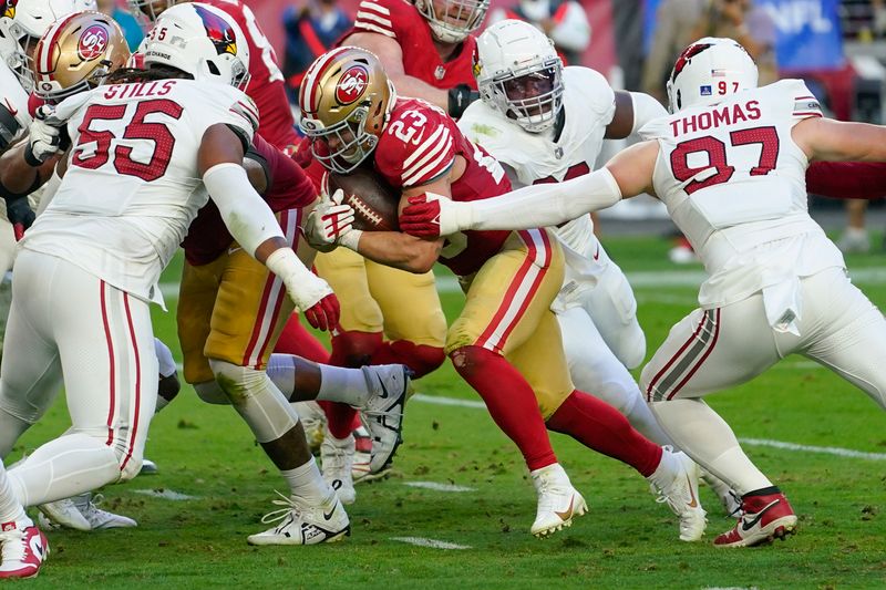 San Francisco 49ers running back Christian McCaffrey (23) runs for a touchdown against the Arizona Cardinals during the second half of an NFL football game Sunday, Dec. 17, 2023, in Glendale, Ariz. (AP Photo/Matt York)