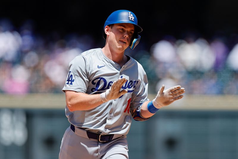 Jun 20, 2024; Denver, Colorado, USA; Los Angeles Dodgers catcher Will Smith (16) gestures as he rounds the bases on a solo home run in the fourth inning against the Colorado Rockies at Coors Field. Mandatory Credit: Isaiah J. Downing-USA TODAY Sports