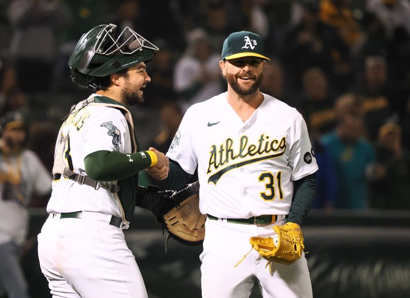 Sep 22, 2023; Oakland, California, USA; Oakland Athletics catcher Shea Langelier (23) celebrates with relief pitcher Zach Neal (31) after a win against the Detroit Tigers at Oakland-Alameda County Coliseum. Mandatory Credit: Kelley L Cox-USA TODAY Sports