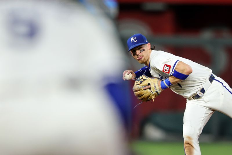 Jun 24, 2024; Kansas City, Missouri, USA; Kansas City Royals shortstop Bobby Witt Jr. (7) looks to throw to first base during the ninth inning against the Miami Marlins at Kauffman Stadium. Mandatory Credit: William Purnell-USA TODAY Sports