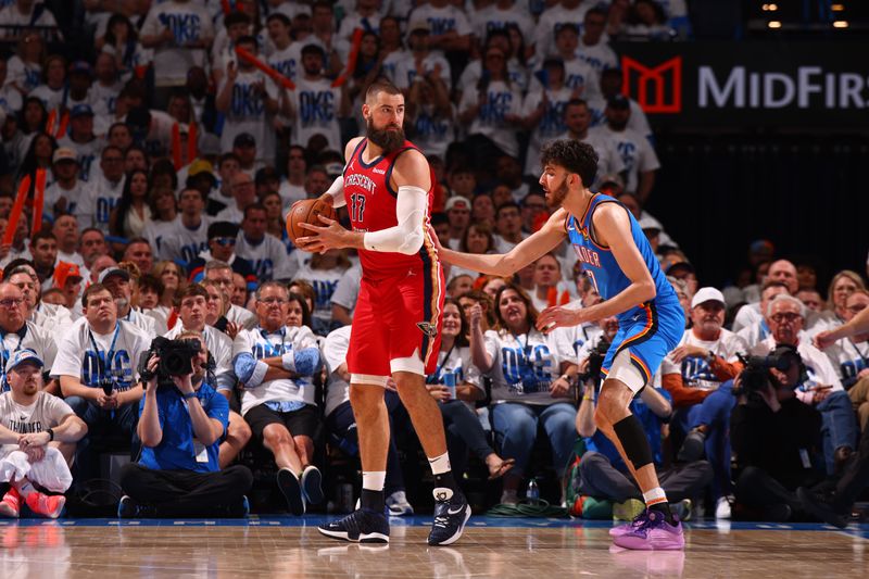 OKLAHOMA CITY, OK - APRIL 24: Jonas Valanciunas #17 of the New Orleans Pelicans handles the ball during the game against the Oklahoma City Thunder during Round 1 Game 2 of the 2024 NBA Playoffs on April 24, 2024 at Paycom Arena in Oklahoma City, Oklahoma. NOTE TO USER: User expressly acknowledges and agrees that, by downloading and or using this photograph, User is consenting to the terms and conditions of the Getty Images License Agreement. Mandatory Copyright Notice: Copyright 2024 NBAE (Photo by Zach Beeker/NBAE via Getty Images)