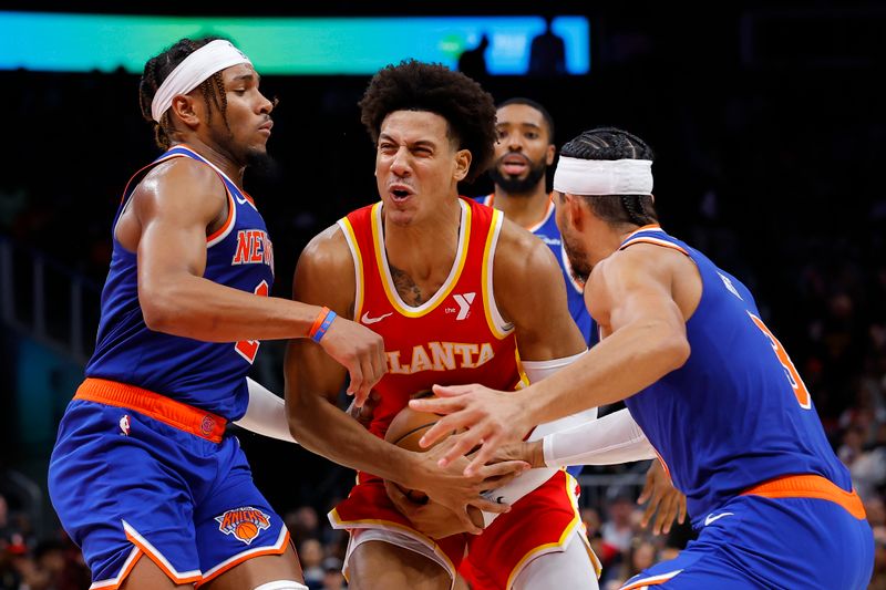 ATLANTA, GEORGIA - NOVEMBER 6: Jalen Johnson #1 of the Atlanta Hawks battles Miles McBride #2 and Josh Hart #3 of the New York Knicks during the fourth quarter at State Farm Arena on November 6, 2024 in Atlanta, Georgia. NOTE TO USER: User expressly acknowledges and agrees that, by downloading and or using this photograph, User is consenting to the terms and conditions of the Getty Images License Agreement. (Photo by Todd Kirkland/Getty Images)