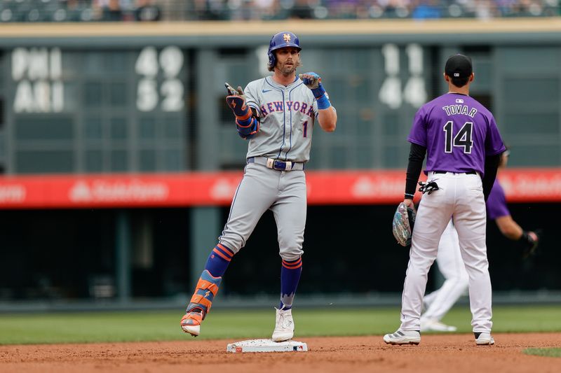 Aug 8, 2024; Denver, Colorado, USA; New York Mets right fielder Jeff McNeil (1) reacts ahead of Colorado Rockies shortstop Ezequiel Tovar (14) on a double in the first inning at Coors Field. Mandatory Credit: Isaiah J. Downing-USA TODAY Sports