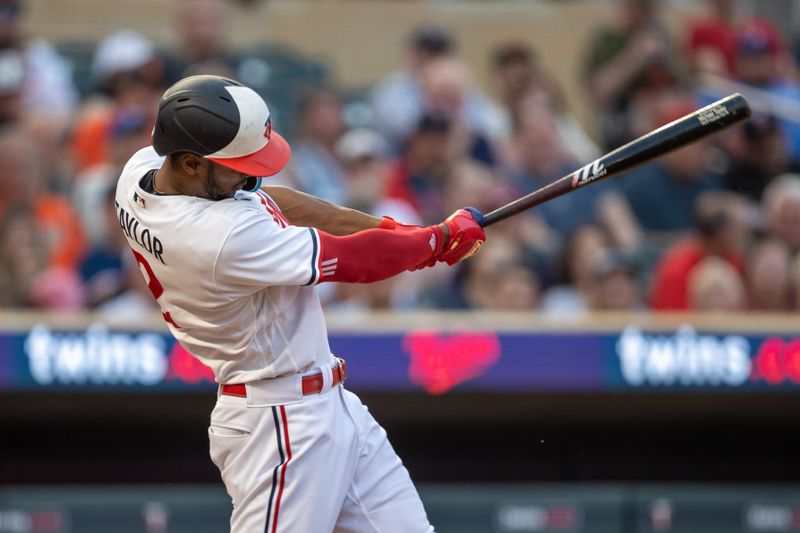 May 23, 2023; Minneapolis, Minnesota, USA; Minnesota Twins center fielder Michael A. Taylor (2) hits a solo home run in the fifth inning against the San Francisco Giants at Target Field. Mandatory Credit: Jesse Johnson-USA TODAY Sports