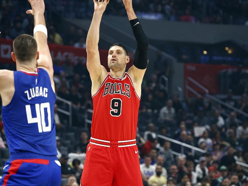 LOS ANGELES, CALIFORNIA - MARCH 09:  Nikola Vucevic #9 of the Chicago Bulls takes a shot against Ivica Zubac #40 of the LA Clippers in the first half at Crypto.com Arena on March 09, 2024 in Los Angeles, California.  NOTE TO USER: User expressly acknowledges and agrees that, by downloading and/or using this photograph, user is consenting to the terms and conditions of the Getty Images License Agreement.  (Photo by Ronald Martinez/Getty Images)