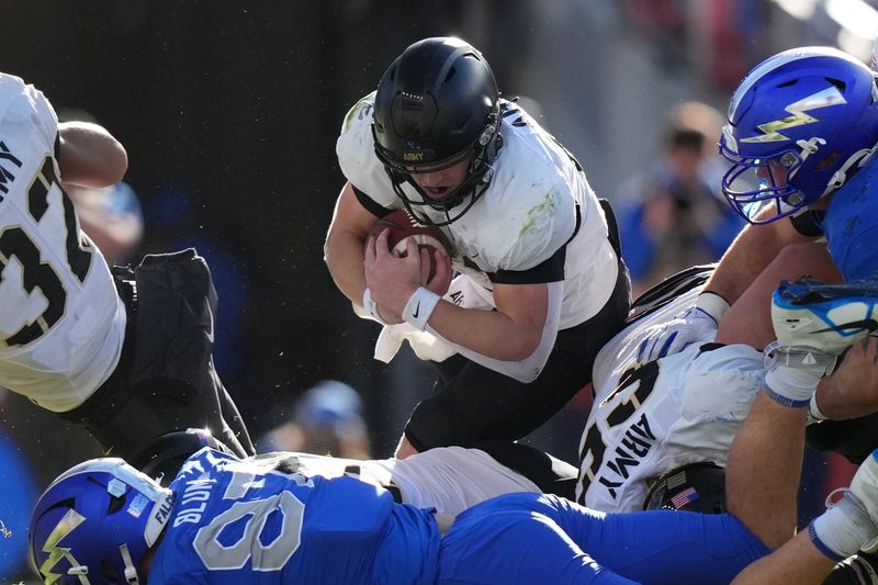 Nov 4, 2023; Denver, Colorado, USA; Army Black Knights quarterback Bryson Daily (13) carries the ball in the third quarter against the Air Force Falcons at Empower Field at Mile High. Mandatory Credit: Ron Chenoy-USA TODAY Sports