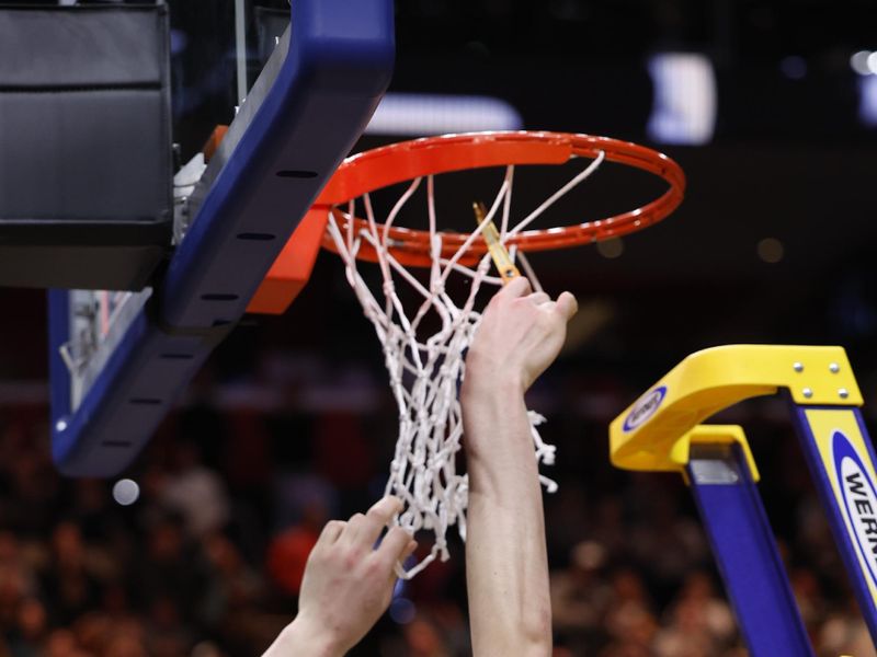 Mar 31, 2024; Detroit, MI, USA; Purdue Boilermakers center Zach Edey (15) cuts down the net after defeating the Tennessee Volunteers during the NCAA Tournament Midwest Regional Championship at Little Caesars Arena. Mandatory Credit: Rick Osentoski-USA TODAY Sports