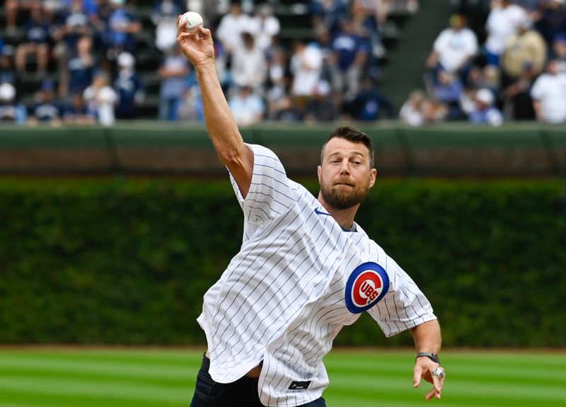 Sep 8, 2023; Chicago, Illinois, USA;  Chicago Cubs former player Ben Zobrist, who was the 2016 World Series MVP,  throws out a ceremonial first pitch  before the team s game against the Arizona Diamondbacks at Wrigley Field. Mandatory Credit: Matt Marton-USA TODAY Sports