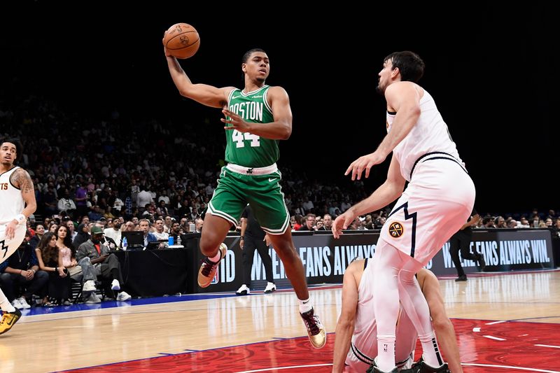 ABU DHABI, UAE - OCTOBER 4: Jaden Springer #44 of the Boston Celtics passes the ball during the game against the Denver Nuggets during the 2024 Global Games on October 4, 2024 at the Etihad Arena in Abu Dhabi, United Arab Emirates. NOTE TO USER: User expressly acknowledges and agrees that, by downloading and/or using this Photograph, user is consenting to the terms and conditions of the Getty Images License Agreement. Mandatory Copyright Notice: Copyright 2024 NBAE (Photo by Brian Babineau/NBAE via Getty Images)