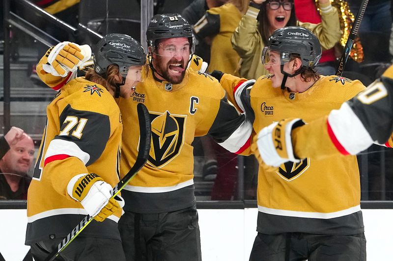 Oct 17, 2023; Las Vegas, Nevada, USA; Vegas Golden Knights center William Karlsson (71) celebrates with Vegas Golden Knights right wing Mark Stone (61) and Vegas Golden Knights defenseman Kaedan Korczak (6) after scoring a goal against the Dallas Stars during the third period at T-Mobile Arena. Mandatory Credit: Stephen R. Sylvanie-USA TODAY Sports