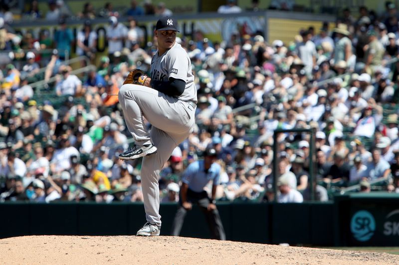 May 10, 2025; West Sacramento, California, USA; New York Yankees pitcher Fernando Cruz (63) throws a pitch against the Athletics during the seventh inning at Sutter Health Park. Mandatory Credit: Dennis Lee-Imagn Images