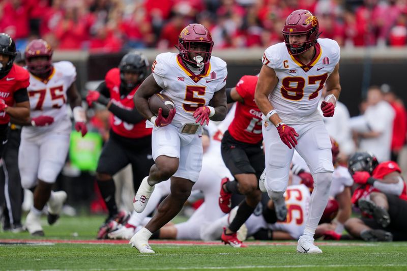 Oct 14, 2023; Cincinnati, Ohio, USA;  Iowa State Cyclones running back Cartevious Norton (5) carries the ball alongside tight end Easton Dean (87) in the game against the Cincinnati Bearcats in the first half at Nippert Stadium. Mandatory Credit: Aaron Doster-USA TODAY Sports