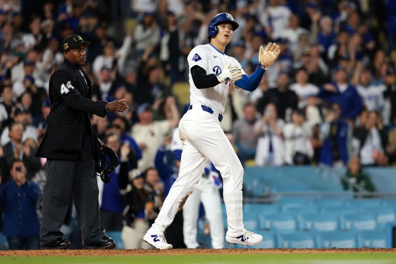 May 17, 2024; Los Angeles, California, USA;  Los Angeles Dodgers designated hitter Shohei Ohtani (17) reacts after scoring a run during the seventh inning against the Cincinnati Reds at Dodger Stadium. Mandatory Credit: Kiyoshi Mio-USA TODAY Sports