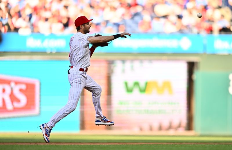 Apr 20, 2024; Philadelphia, Pennsylvania, USA; Philadelphia Phillies shortstop Trea Turner (7) throws to first against the Chicago White Sox in the second inning at Citizens Bank Park. Mandatory Credit: Kyle Ross-USA TODAY Sports