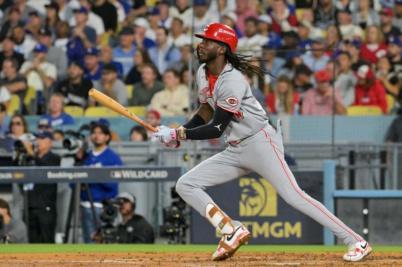 Oct 1, 2025; Los Angeles, California, USA; Cincinnati Reds shortstop Elly De La Cruz (44) watches after hitting the ball into play against the Los Angeles Dodgers in the fourth inning during game two of the Wildcard round for the 2025 MLB playoffs at Dodger Stadium. Mandatory Credit: Jayne Kamin-Oncea-Imagn Images