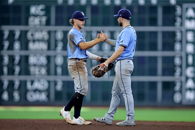 Aug 4, 2024; Houston, Texas, USA; Tampa Bay Rays shortstop Taylor Walls (6) and second baseman Brandon Lowe (8) congratulate each other following the final out against the Houston Astros during the ninth inning at Minute Maid Park. Mandatory Credit: Erik Williams-USA TODAY Sports