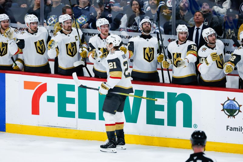 Jan 6, 2026; Winnipeg, Manitoba, CAN; Vegas Golden Knights forward Brett Howden (21) is congratulated by his teammates after his goal against the Winnipeg Jets during the third period at Canada Life Centre. Mandatory Credit: Terrence Lee-Imagn Images