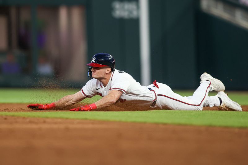 Apr 11, 2023; Atlanta, Georgia, USA; Atlanta Braves center fielder Sam Hilliard (14) slides into second base with a double against the Cincinnati Reds in the third inning at Truist Park. Mandatory Credit: Brett Davis-USA TODAY Sports
